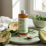 Bouteille Rituel Foie Détox Bio Archie avec artichauts et romarin sur surface wellness