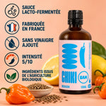 Sauce piquante bio Mogador Chiki Bam 100 mL, lacto-fermentée, fabriquée en France, intensité 5/10, sur fond pêche