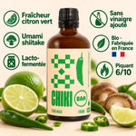 Sauce piquante bio Thaï Max Chiki Bam 100 mL, flacon ambré avec étiquette crème, citron vert et piments frais, intensité 6/10