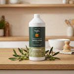 Savon Noir d'Alep Liquide Najel Bio 1L avec branches d'olivier sur surface bois