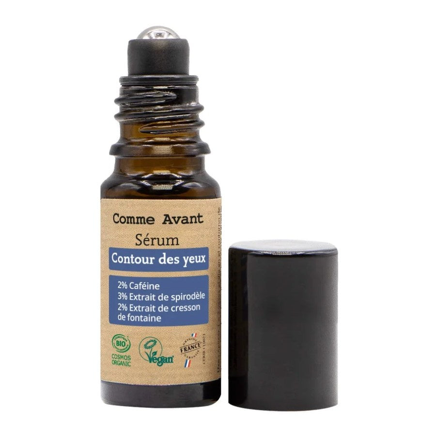Le serum contour des yeux de Comme Avant est posé, ouvert, et avec la bille en métal visible