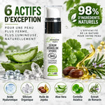 Flacon Dermoline Hydric sérum anti-rides bio avec 6 actifs naturels et ingrédients sur fond marbre blanc