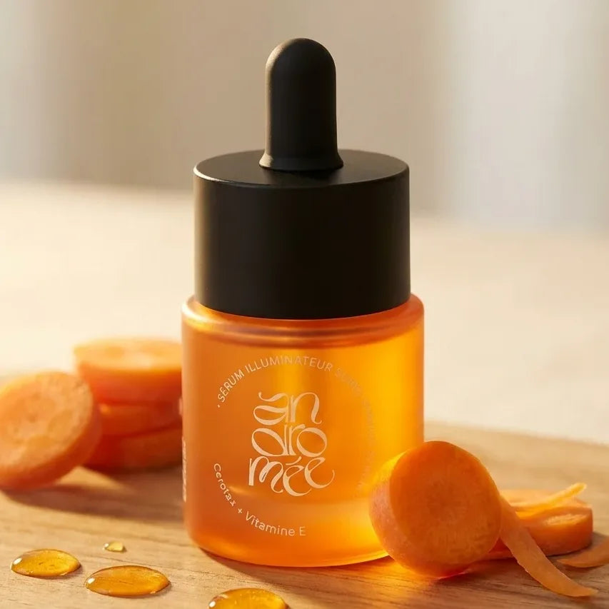 Sérum illuminateur Andromée 15 ml en flacon orange avec carotte, skincare premium