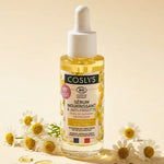 Sérum nourrissant bio Coslys 30ml avec fleurs de camomille sur fond crème