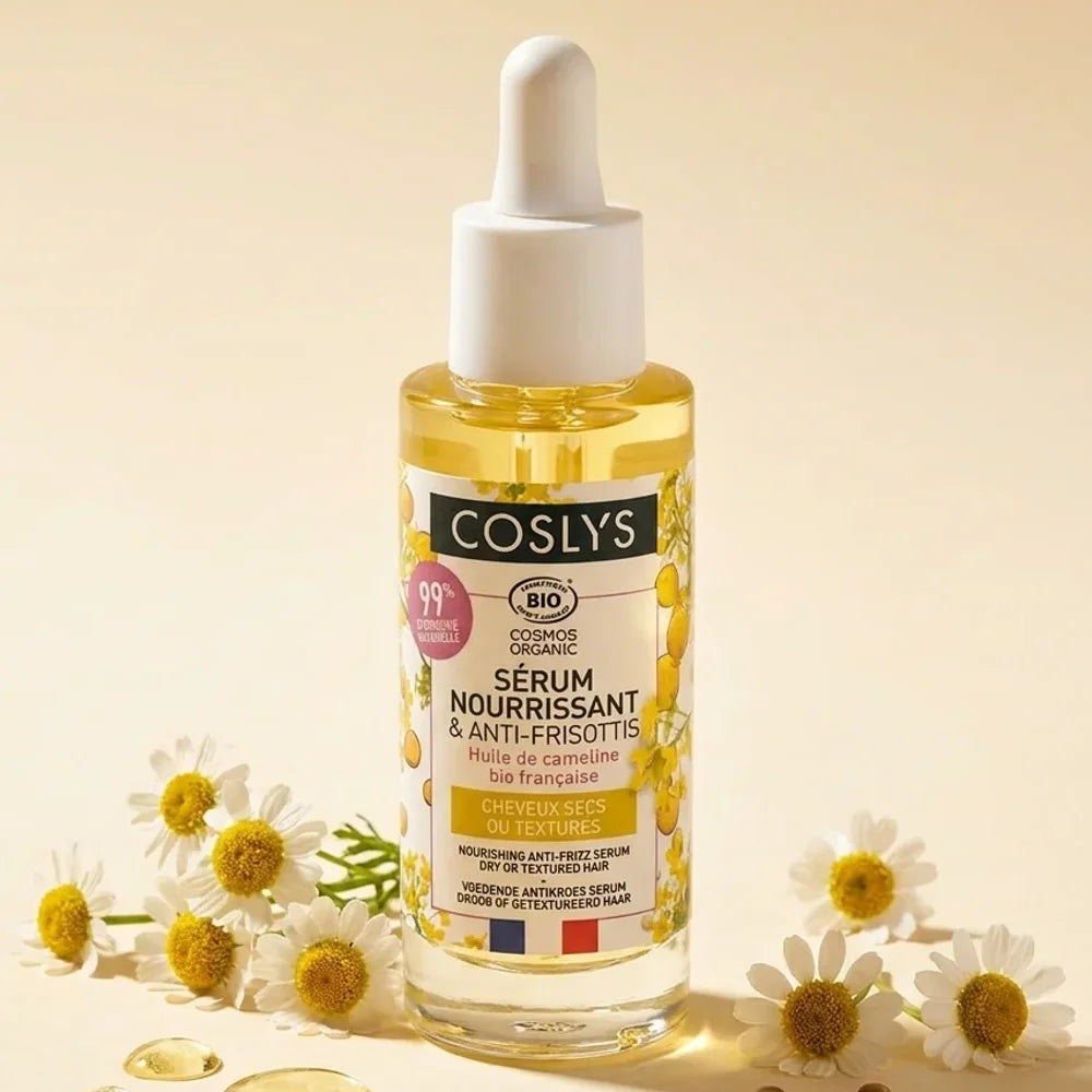 Sérum nourrissant bio Coslys 30ml avec fleurs de camomille sur fond crème