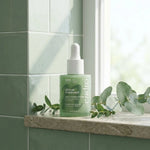Sérum Purifiant Endro 30ml flacon verre vert dans salle de bains moderne