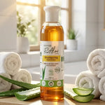 Shampoing Aloé Vera Bio Pur'Aloé 250ml sur étagère salle de bain avec feuilles d'aloé vera