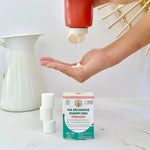 Pack de shampoing fleur de lotus bio de 6 pastilles de la marque Anotherway à côté d'un flacon rechargeable