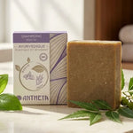 Shampoing solide Antheya anti-pellicules 100g sur marbre avec basil et neem, ambiance spa naturelle