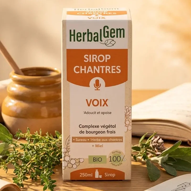 Sirop Chantres Voix enrouée Bio HerbalGem 250ml avec herbes et miel sur bureau