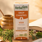 Sirop Chantres Voix enrouée Bio HerbalGem 250ml avec herbes et miel sur bureau