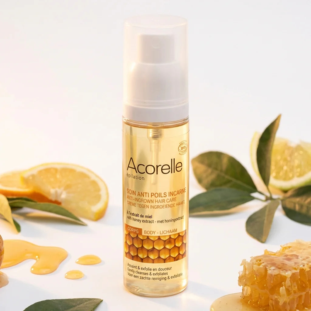 Spray anti-poils incarnés bio Acorelle 50ml avec ingrédients naturels et miel sur fond blanc