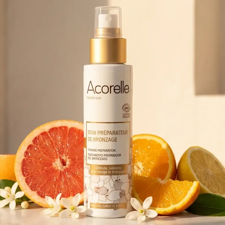 Acorelle Soin Préparateur de Bronzage 100ml sur marbre avec agrumes et fleurs, ambiance été