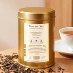 Thé noir Darjeeling Ftgfop1 Chamong Bio en boîte dorée avec feuilles et tasse de thé