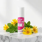 Top Désire stimulant clitoris 60 ml Labophyto sur marbre avec fleurs naturelles