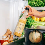 Une bouteille de Vinaigrette Collagène+ Archie rangée au frigidaire